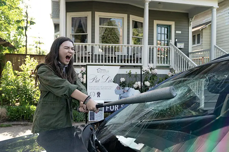 Kaitlyn smashes a car window with a baseball bat in Little Wing