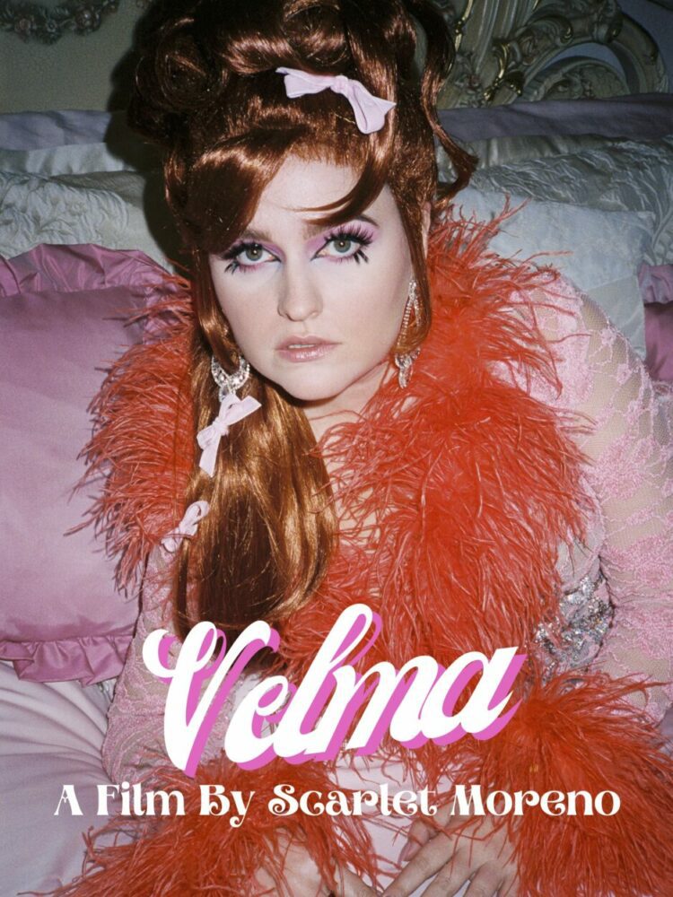 Scarlet Moreno as Velma in the short film Velma (2022). Movie poster featuring Scarlet as Velma in an orange feathery boa.