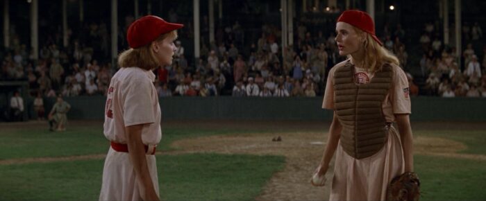 Kit and Dottie have a pitchers/catcher visit on the baseball mound during a game