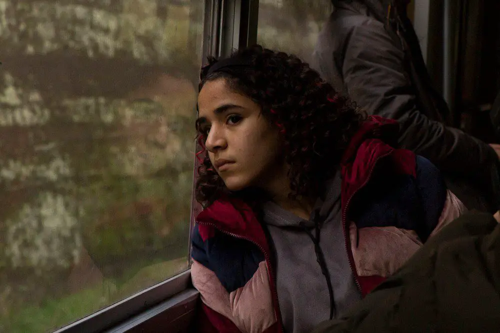 Kahaduua Jaafari as Jamila stares out a train window
