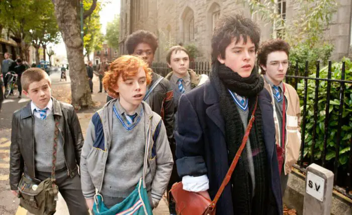 The titular band Sing Street in the film, all walking together as the article celebrates St. Patrick's Day