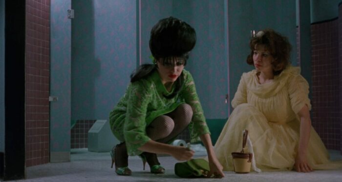 Rose (Lili Taylor) and Marcie (E. G. Daily) on the floor of the bathroom.