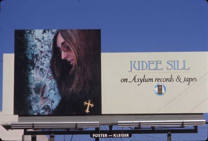 Billboard of Judee Sill in the documentary Lost Angel: The Genius of Judee Sill. Greenwich Entertainment. Billboard advertising Judee Sill's self-titled album on Asylum Records.