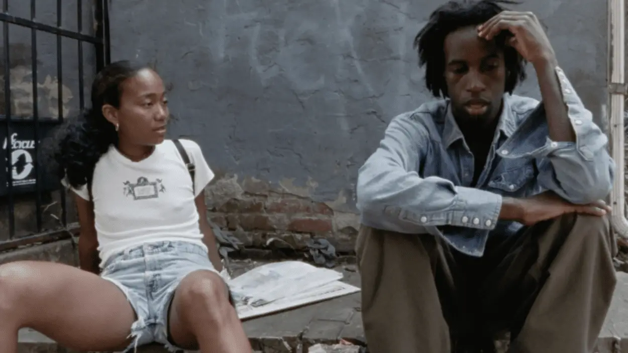 Lauren (Sonja Sohn) and Ray (Saul Williams) in dialogue on a concrete city stoop.