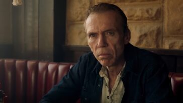 Richard Brake as Beau in the western/crime/thriller, THE LAST STOP IN YUMA COUNTY, a Well Go USA release. Photo courtesy of Well Go USA. Beau, a bank robber on the run, sits in a diner booth looking reptilian and dangerous.