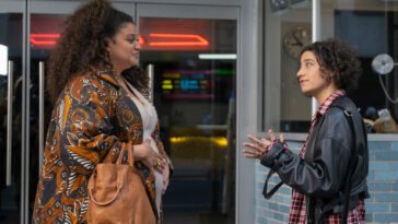 Michelle Buteau and Ilana Glazer as Dawn and Eden in BABES. Photo Credit to Gwen Capistran. Photo Courtesy of NEON. Dawn and Eden, two New York City ladies standing out front of a movie theater.