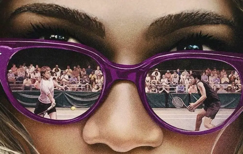 Poster image from Challengers featuring tennis players Art and Patrick reflected in Tashi's sunglasses.