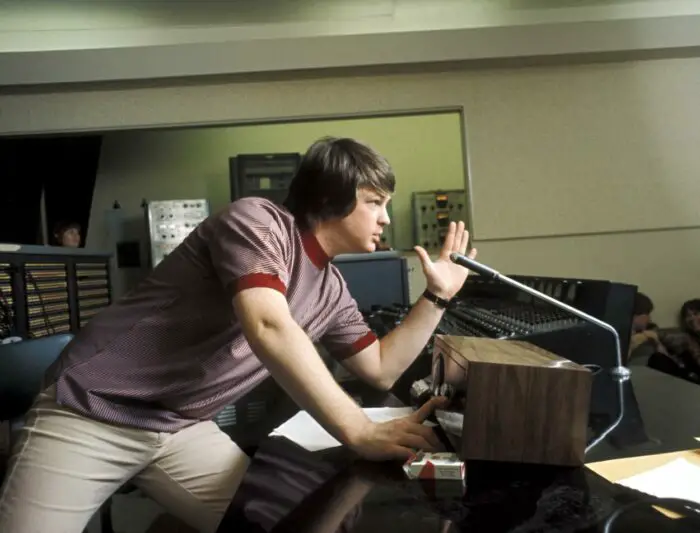 LOS ANGELES - 1966: Singer and mastermind Brian Wilson of the rock and roll band "The Beach Boys" directs from the control room while recording the album "Pet Sounds" in 1966 in Los Angeles, California. (Photo by Michael Ochs Archives/Getty Images). Brian Wilson in an audio studio at a bank of controls.
