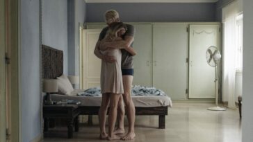 Adam (Dobromir Dymecki) and Anna (Agnieszka Zulewska) embrace in their rented villa.