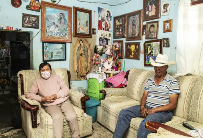 Male's parents in their home in a scene from Mexican Dream.