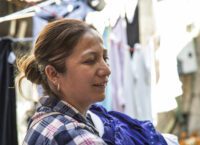 María Magdalena hangs laundry in Mexican Dream.