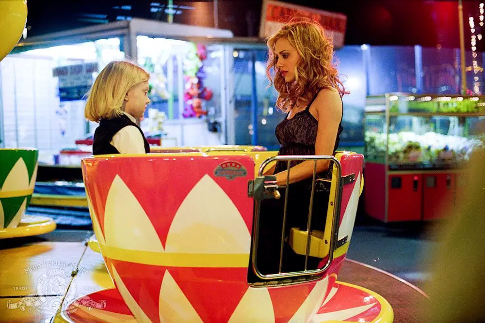 A girl and a woman rid in a teacup ride in Uptown Girls.