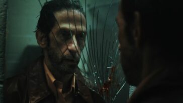 A man looks at his reflective in a broken mirror in Bang Bang.