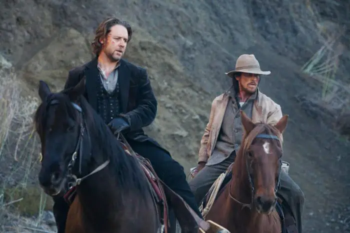 Two men ride horses in the western 3:10 to Yuma.