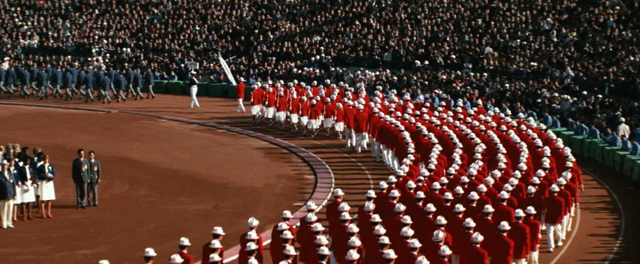 A still image capturing the opening ceremonies of the 1964 Tokyo Olympics.