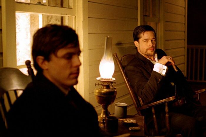 Two men talk on a porch in the western The Assassination of Jesse James by the Coward Robert Ford.