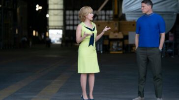 Kelly Jones (Scarlett Johansson) and Cole Davis (Channing Tatum) in FLY ME TO THE MOON. Kelly and Cole in a NASA hangar chit chatting.