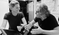 Christine Handy (L) and Ziad Hamzeh talk on the set of Hello Beautiful.