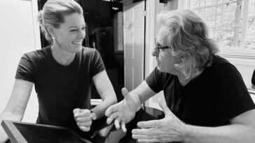 Christine Handy (L) and Ziad Hamzeh talk on the set of Hello Beautiful.